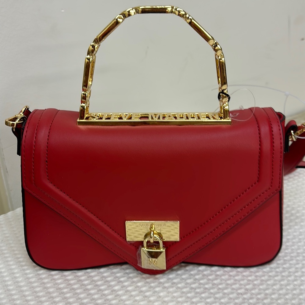 A gorgeous red Steve Madden Bag with gold hardware